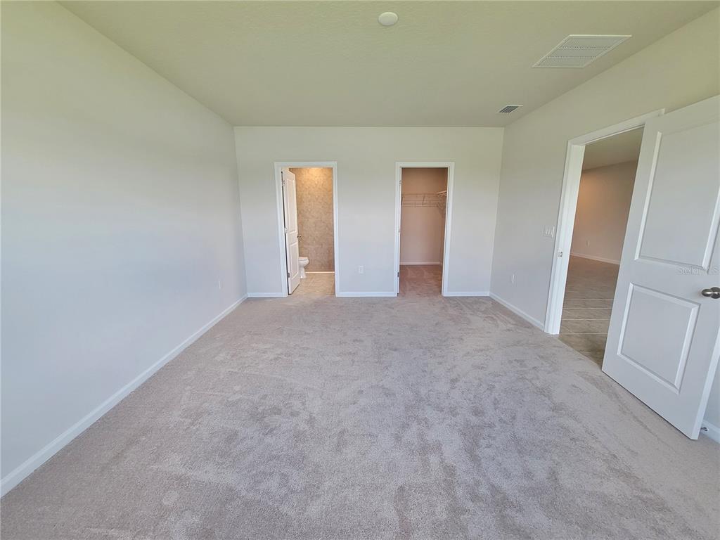 18008 Turning Leaf Circle Land O Lakes, FL 34638 - Photo 28 of 54 a view of an empty room and a window