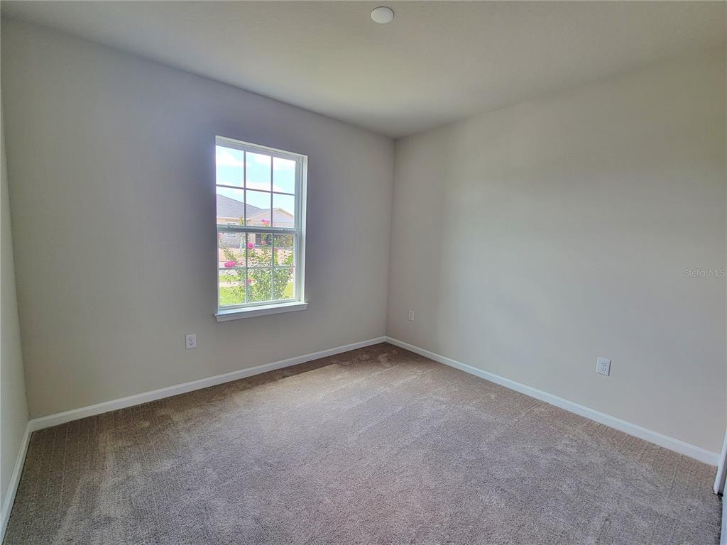 18008 Turning Leaf Circle Land O Lakes, FL 34638 - Photo 34 of 54 an empty room with windows