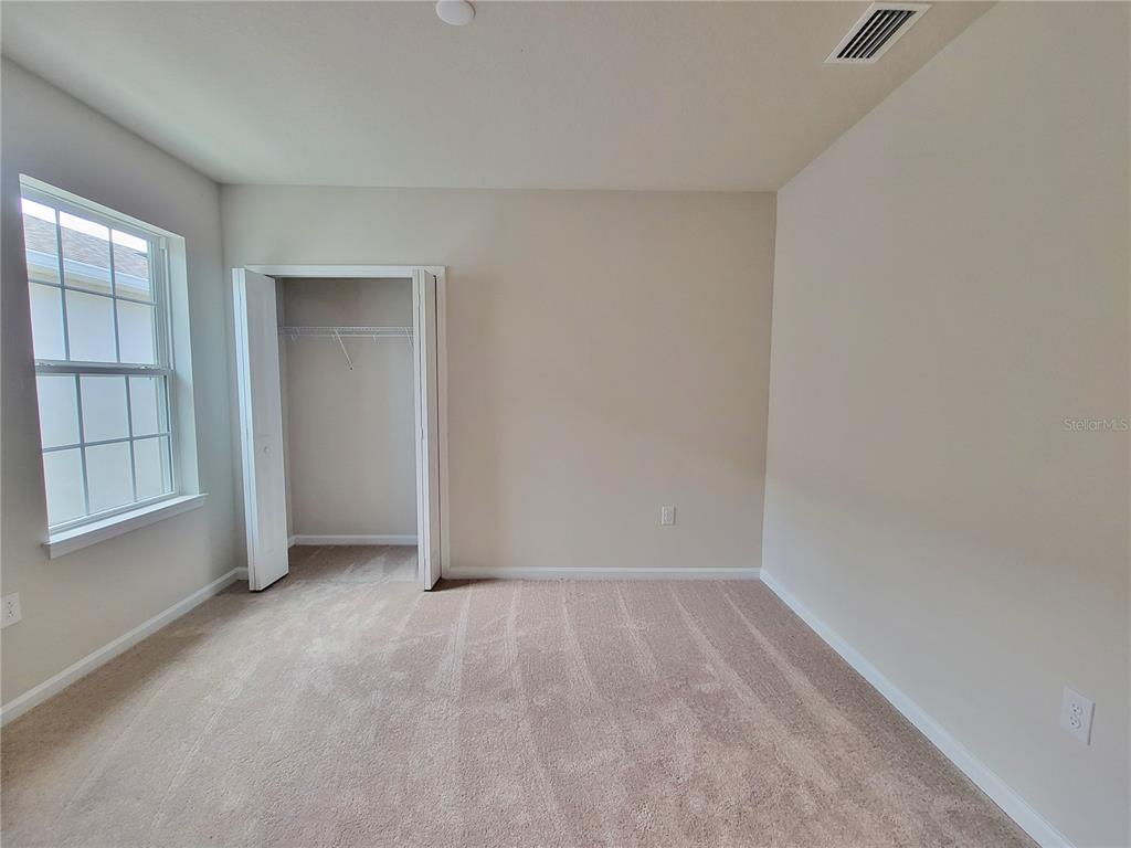 18008 Turning Leaf Circle Land O Lakes, FL 34638 - Photo 37 of 54 an empty room with windows