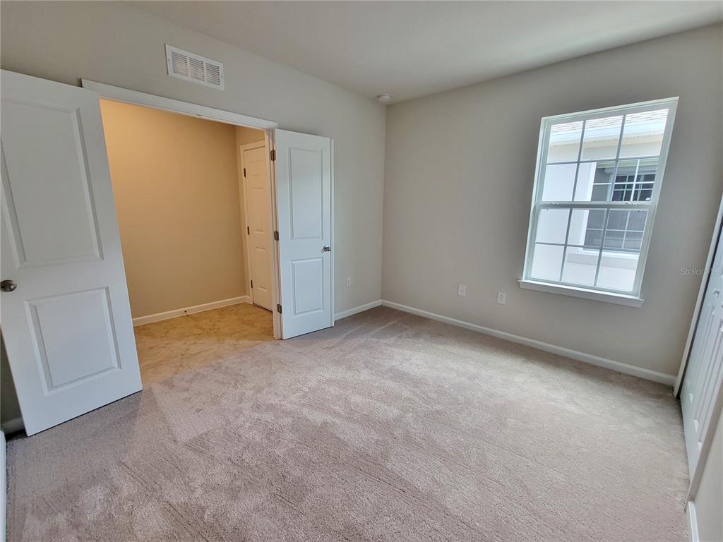 18008 Turning Leaf Circle Land O Lakes, FL 34638 - Photo 38 of 54 an empty room with windows