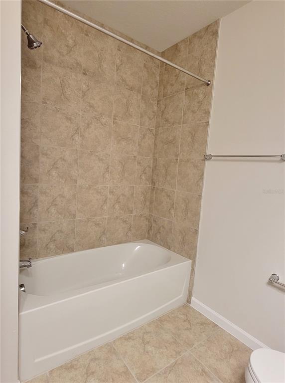 18008 Turning Leaf Circle Land O Lakes, FL 34638 - Photo 42 of 54 a bathroom with a bathtub and a toilet