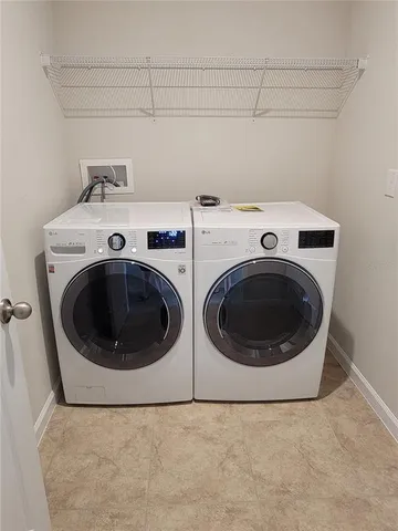 a front view of house with a garden and patio