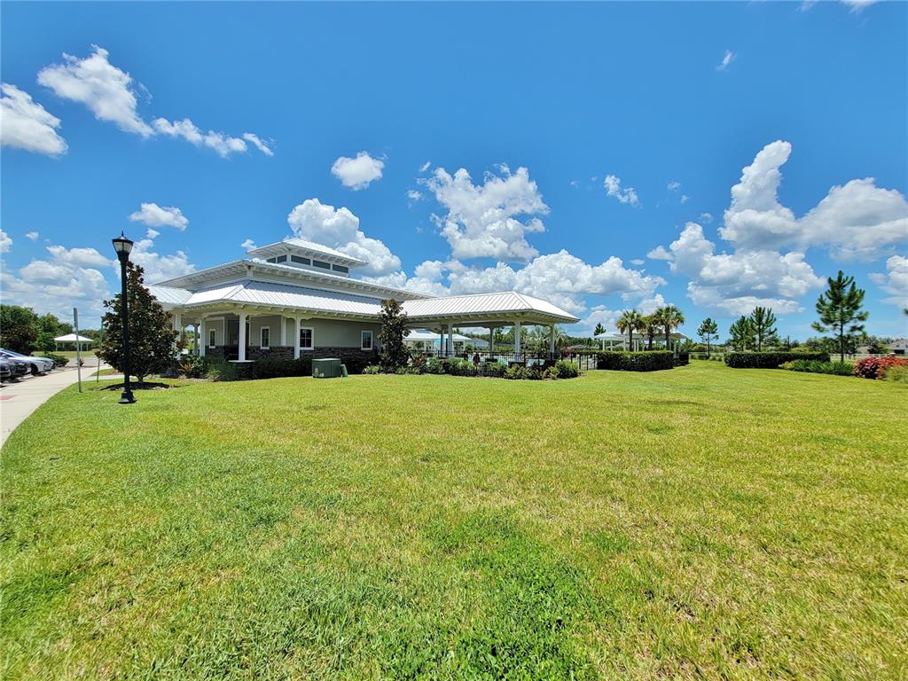 18008 Turning Leaf Circle Land O Lakes, FL 34638 - Photo 52 of 54 a front view of a house with garden