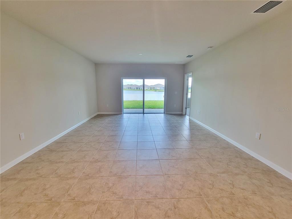 18008 Turning Leaf Circle Land O Lakes, FL 34638 - Photo 10 of 54 a view of an empty room with a window