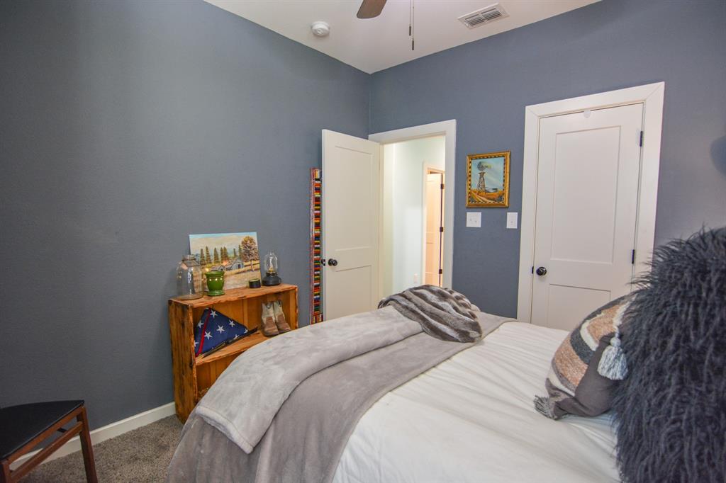 601 Mathew Street Grandview, TX 76050 - Photo 29 of 40 a bedroom with a bed and a window