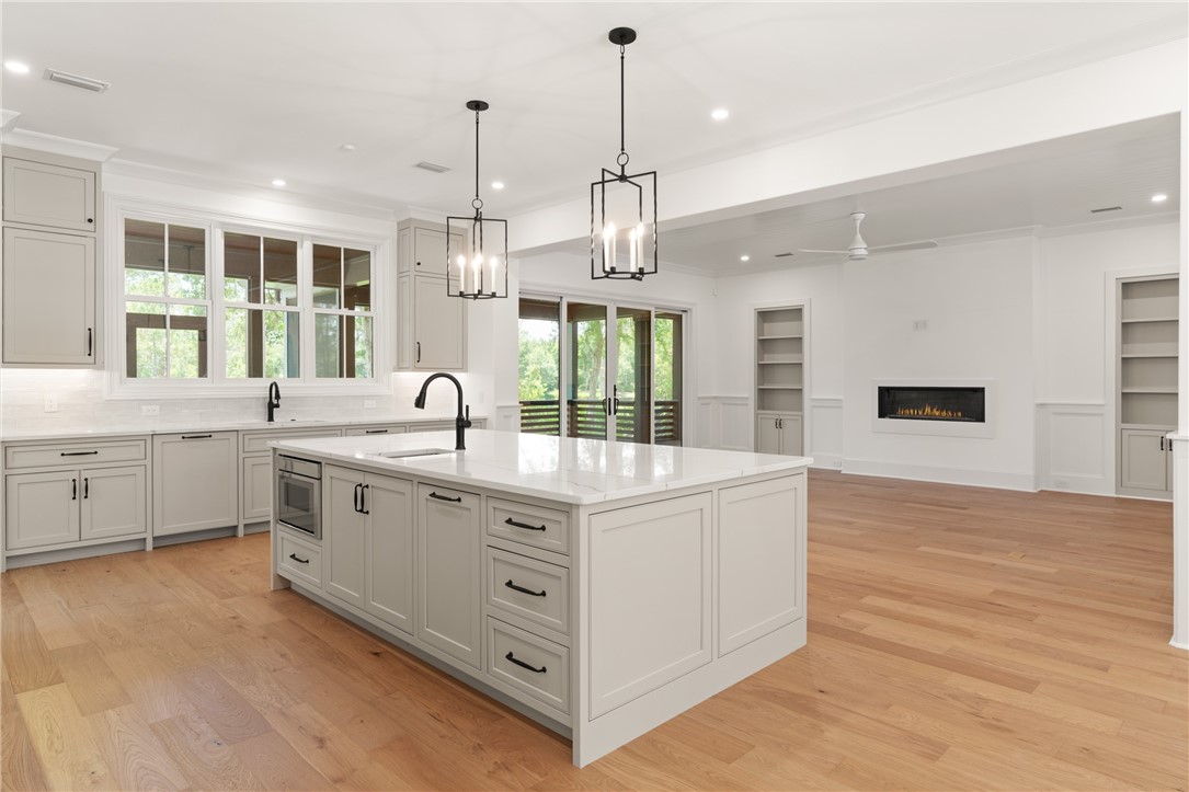 111 Stillwater Drive St. Simons Island, GA 31522 - Photo 10 of 51 view of kitchen and living room from dining room