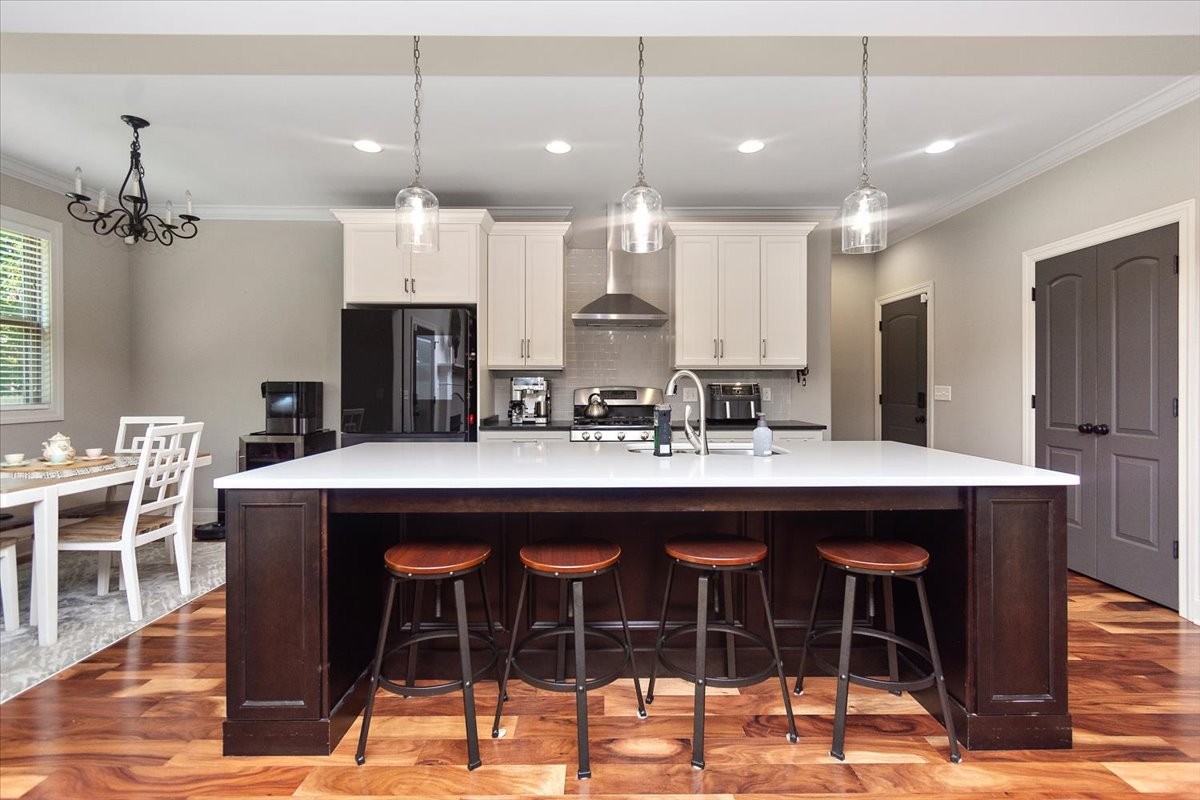 525 Piccadilly Drive Murfreesboro, TN 37128 - Photo 13 of 44 a kitchen island with stainless steel appliances kitchen island granite countertop a dining table and chairs