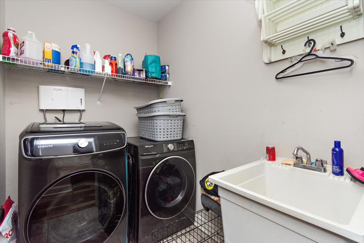 525 Piccadilly Drive Murfreesboro, TN 37128 - Photo 27 of 44 a utility room with dryer washer and racks