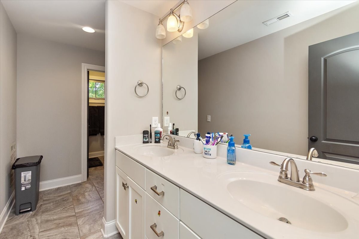 525 Piccadilly Drive Murfreesboro, TN 37128 - Photo 33 of 44 a bathroom with a sink a vanity and a mirror