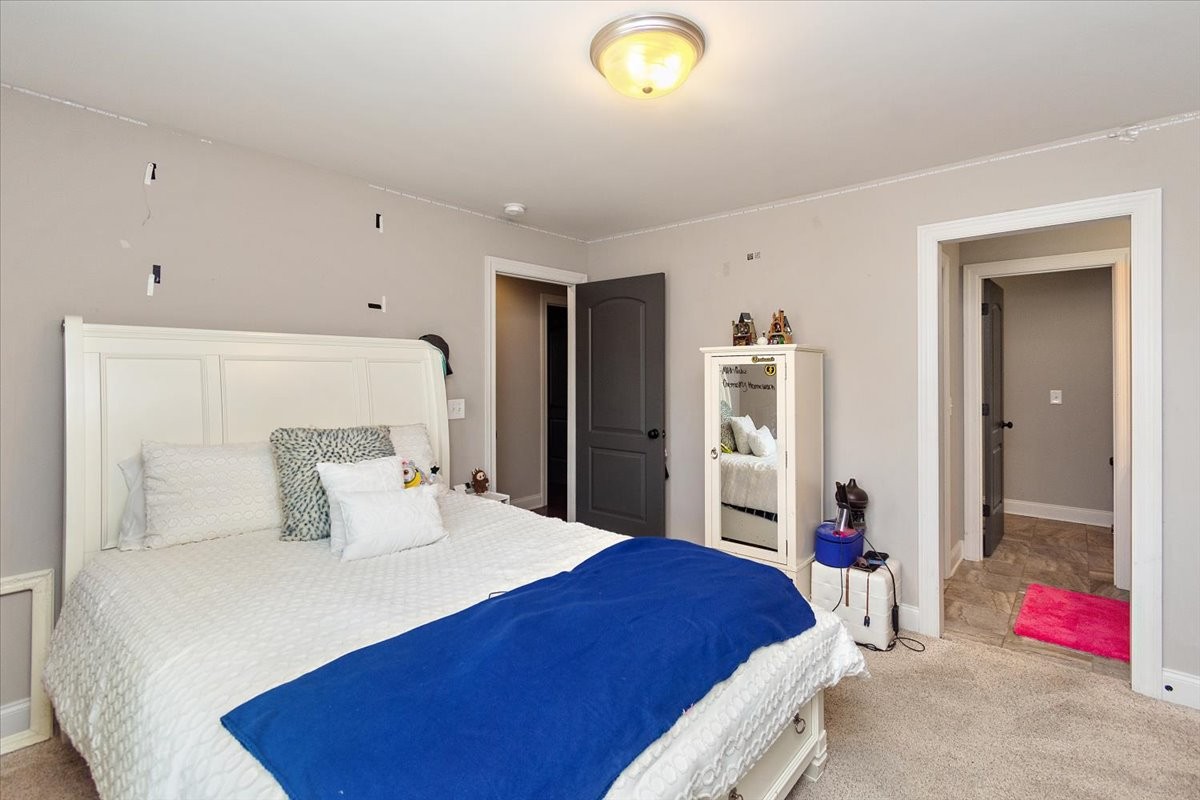 525 Piccadilly Drive Murfreesboro, TN 37128 - Photo 35 of 44 a bedroom with a bed and a couch