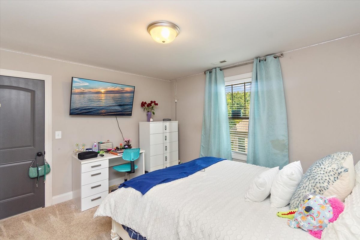 525 Piccadilly Drive Murfreesboro, TN 37128 - Photo 37 of 44 a bedroom with a bed and a flat screen tv