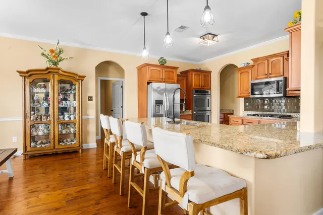 a view of a livingroom with furniture and hardwood floor