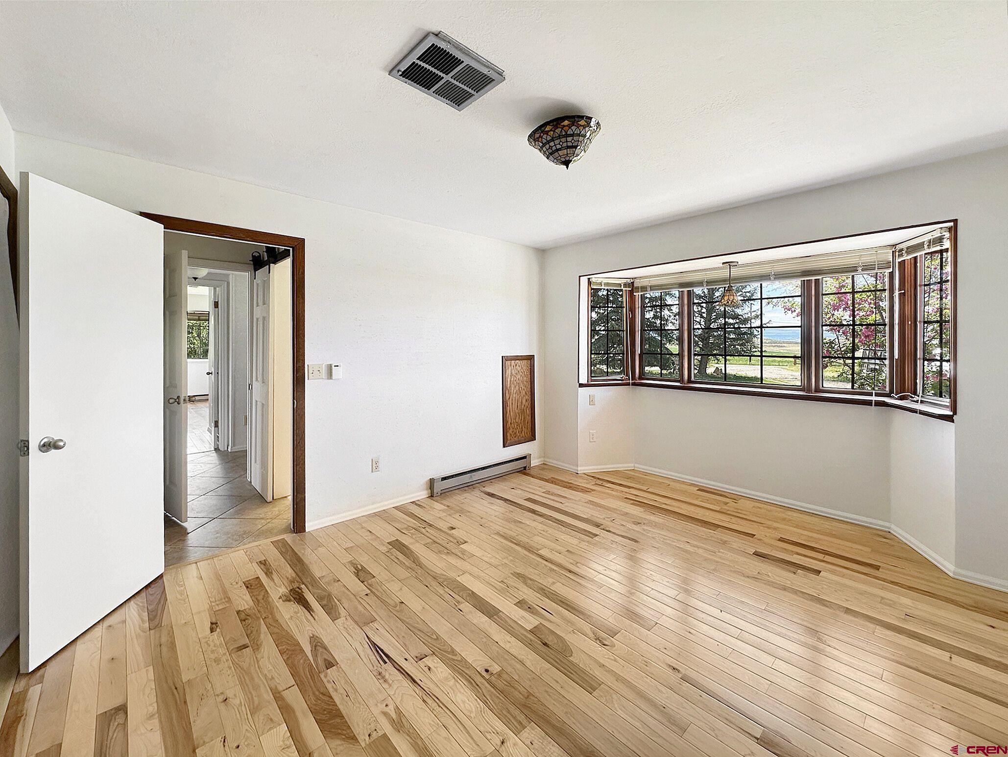 11253 Crawford Road Paonia, CO 81428 - Photo 20 of 44 a bedroom with a bed and a window
