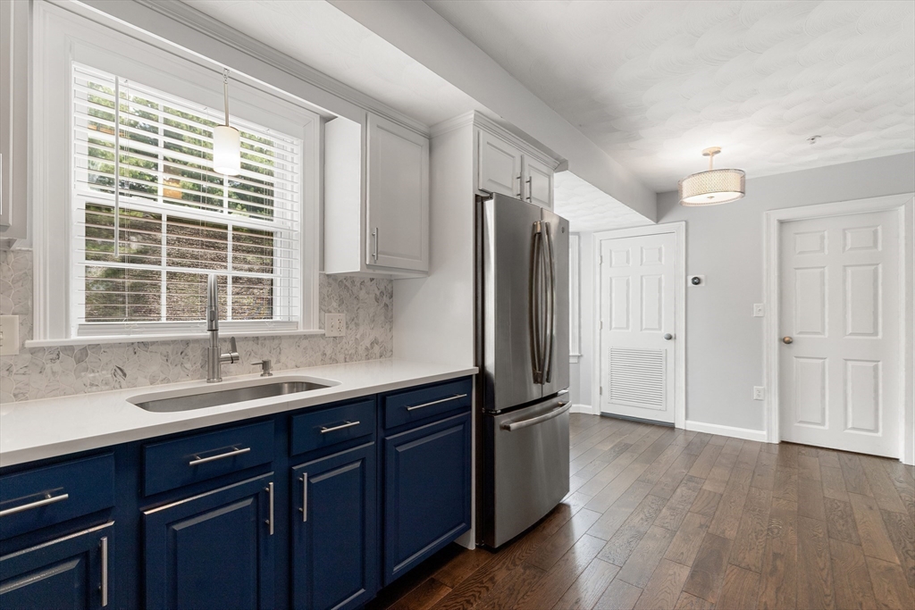 2 Ricciuti Drive, Unit 9 Quincy, MA 02169 - Photo 17 of 40 a kitchen with a sink a refrigerator and window