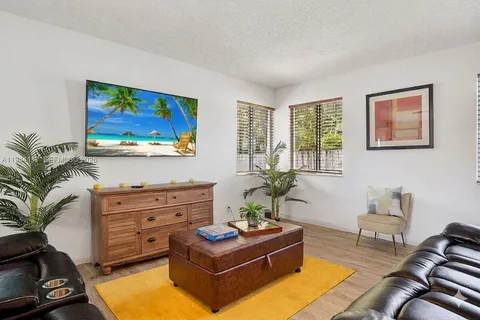 a outdoor space with furniture a flat screen tv and a faucet