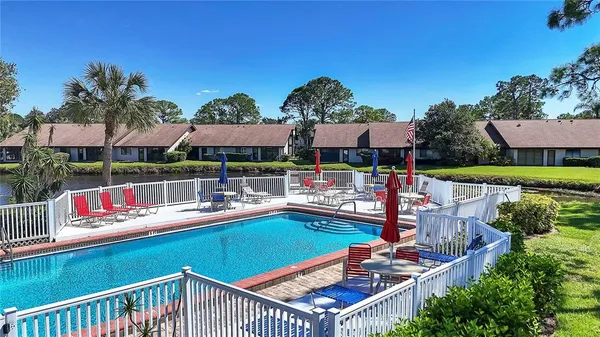 a view of swimming pool with outdoor seating