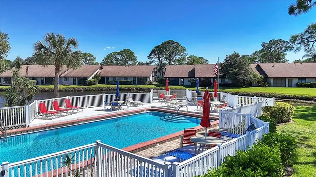 a view of swimming pool with outdoor seating