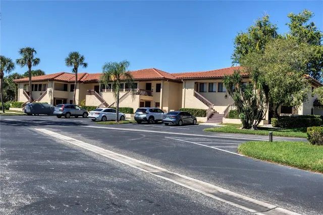 a group of cars parked in front of a house