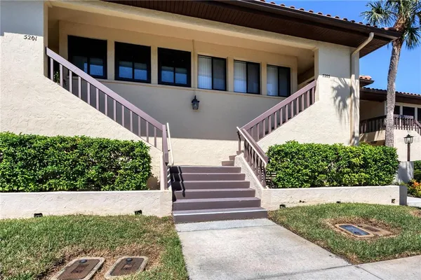 a view of a house with entryway and stairs