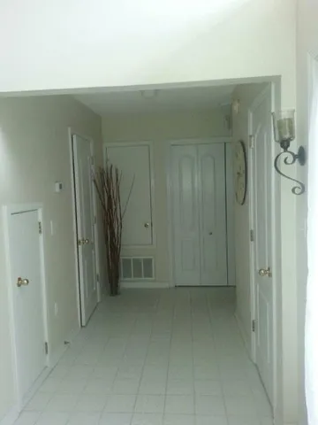 a view of a hallway with closet area