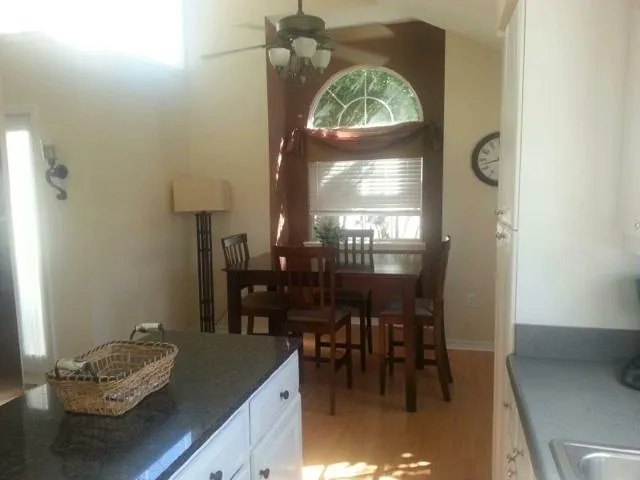 a dining room with furniture and window