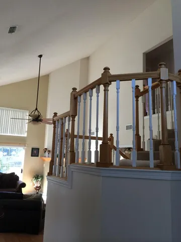 a living room with lots of wooden furniture
