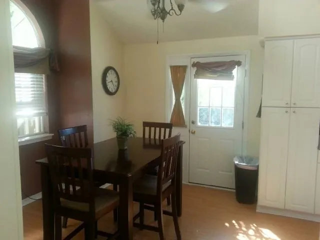 a view of a dining room with furniture and window