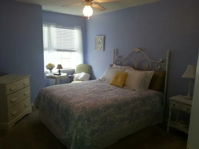 a bedroom with a bed and window