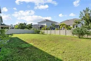 a view of a patio with table and chairs potted plants
