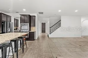 a kitchen with stainless steel appliances granite countertop counter space a sink and cabinets