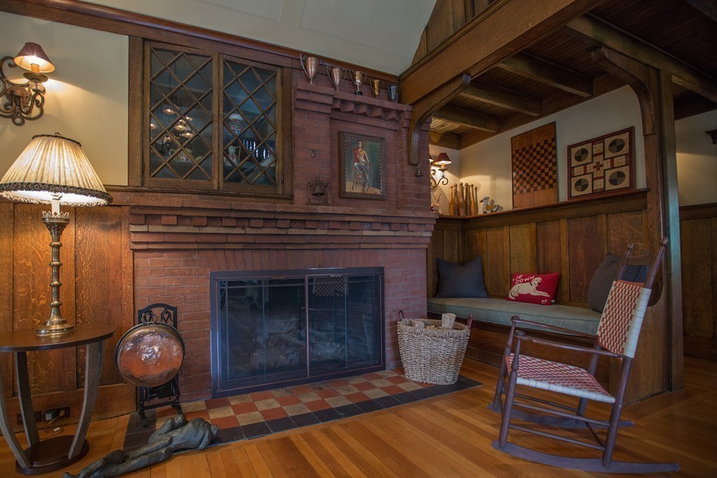 350 Musketaquid Road Concord, MA 01742 - Photo 11 of 24 a living room with furniture and a fireplace