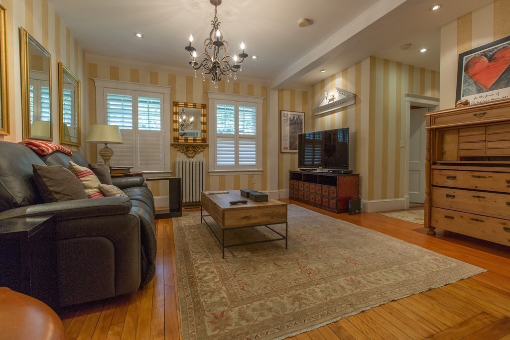 350 Musketaquid Road Concord, MA 01742 - Photo 14 of 24 a living room with furniture and wooden floor