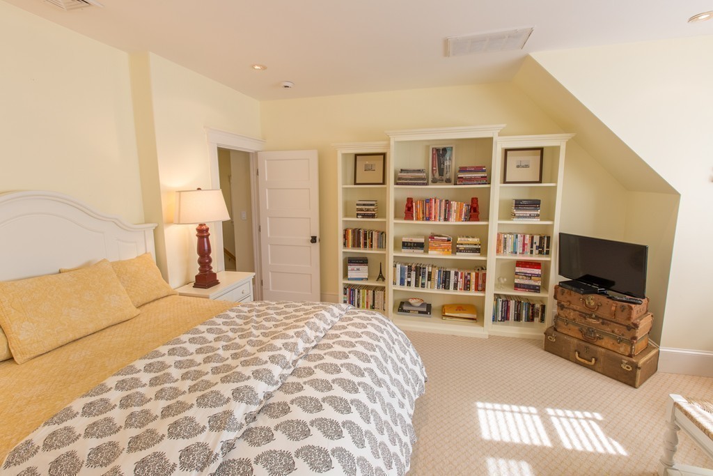 350 Musketaquid Road Concord, MA 01742 - Photo 19 of 24 a spacious bedroom with a bed and a television