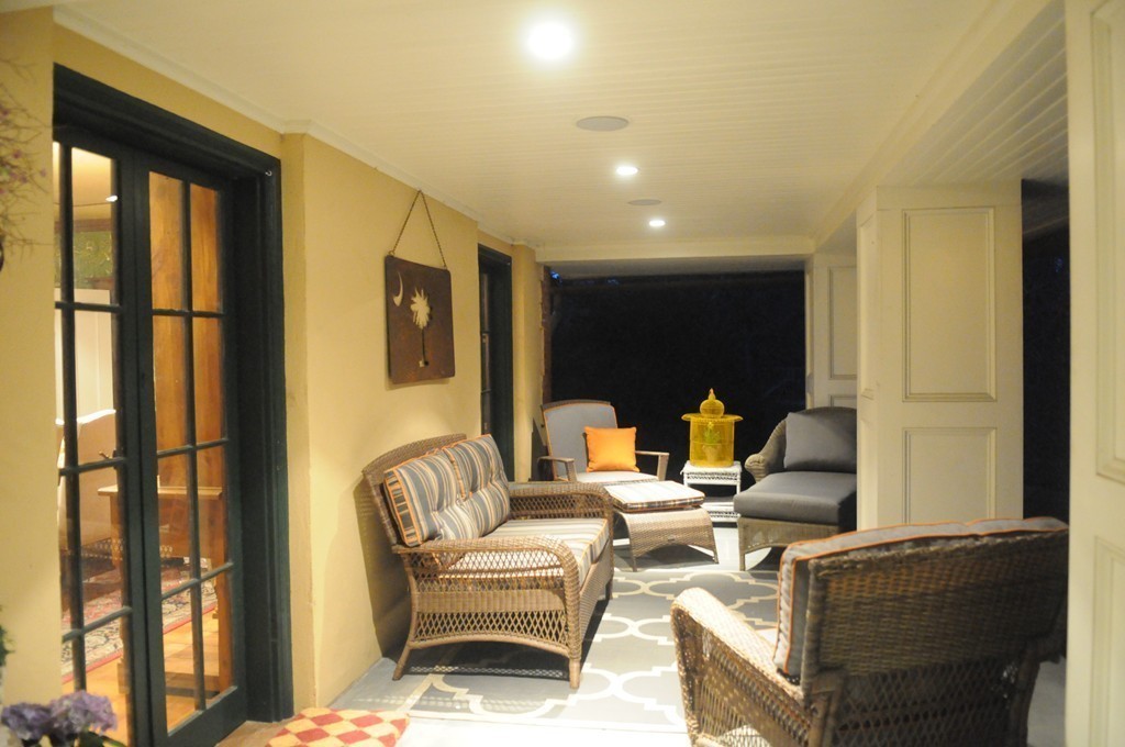 350 Musketaquid Road Concord, MA 01742 - Photo 22 of 24 a living room with fireplace furniture and a floor to ceiling window