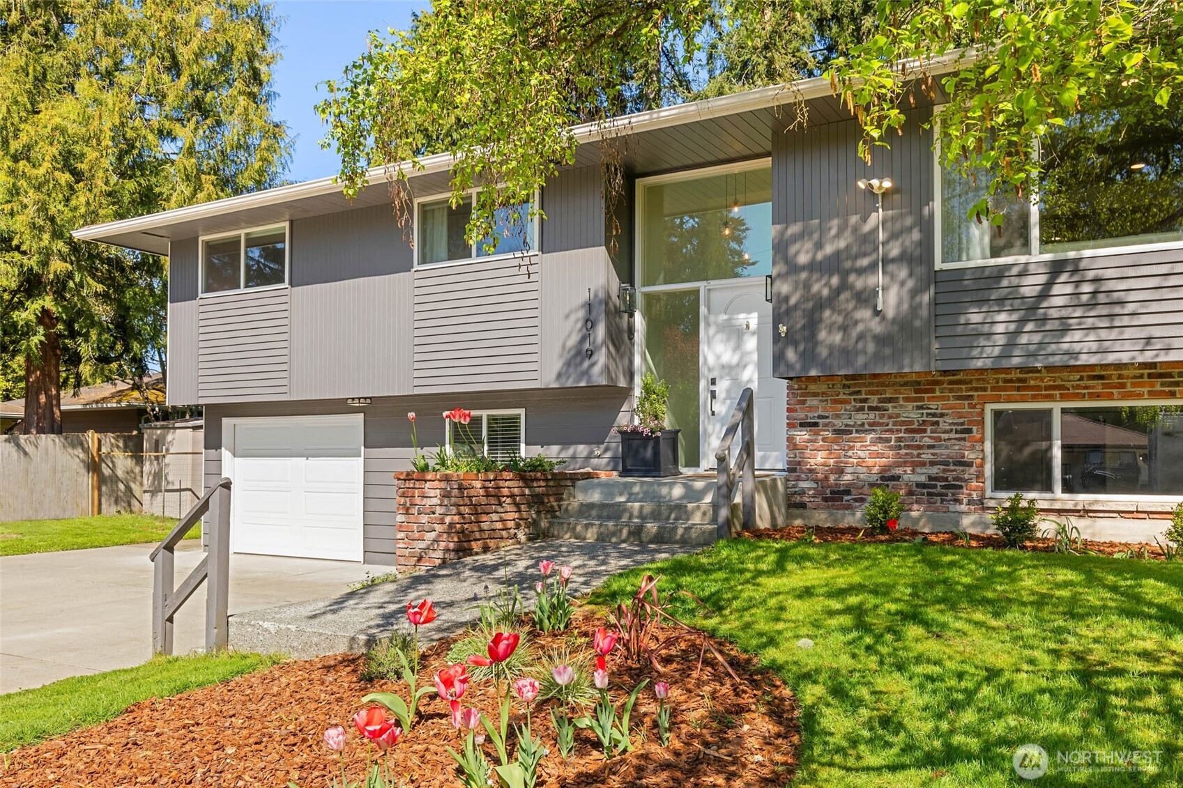 a front view of a house with garden