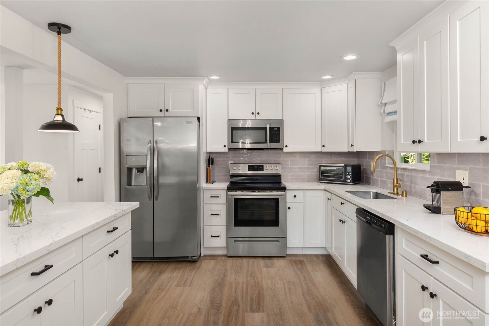 11019 23rd Drive Southeast Everett, WA 98208 - Photo 11 of 35 a kitchen with stainless steel appliances a refrigerator sink and white cabinets