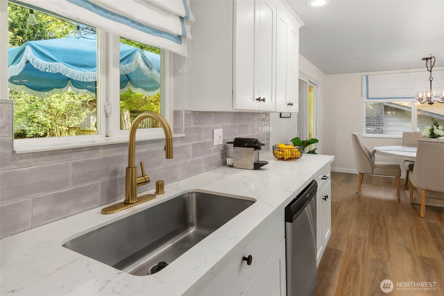 11019 23rd Drive Southeast Everett, WA 98208 - Photo 13 of 35 a kitchen that has a sink a stove and a table with chairs