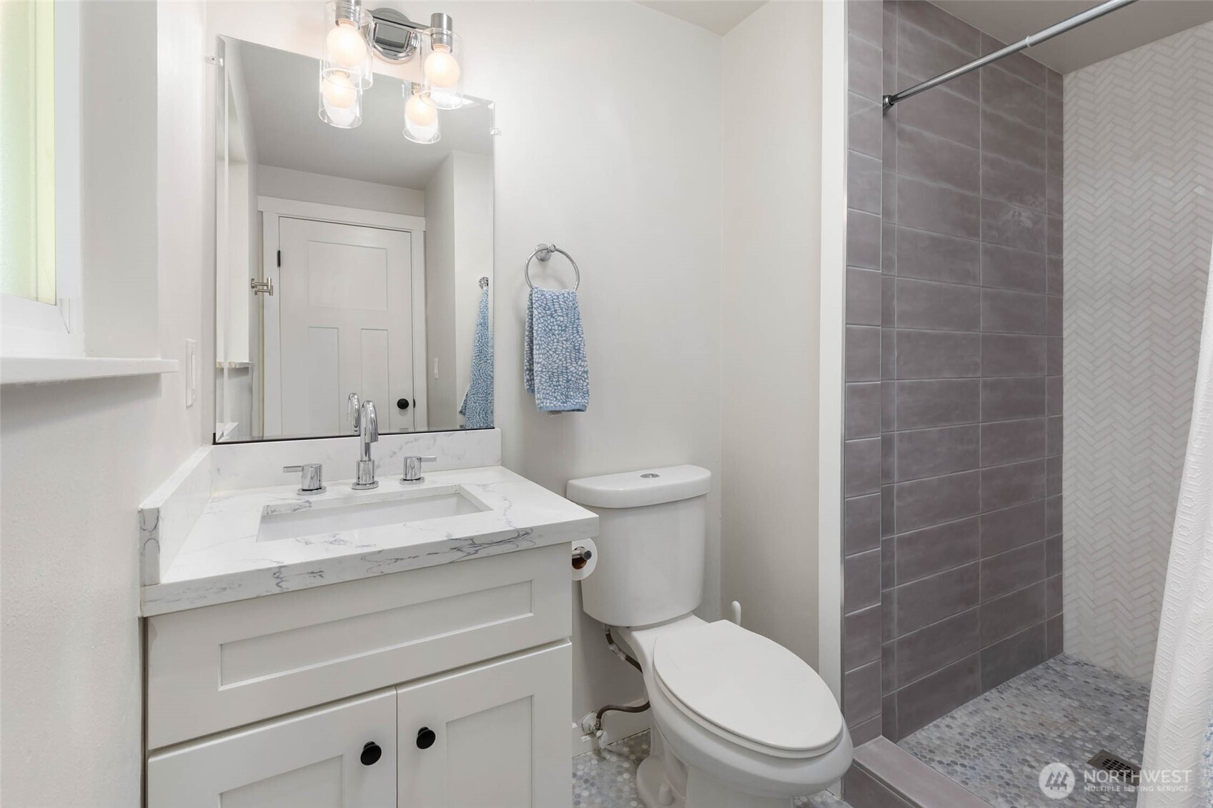 11019 23rd Drive Southeast Everett, WA 98208 - Photo 20 of 35 a bathroom with a granite countertop toilet sink and mirror