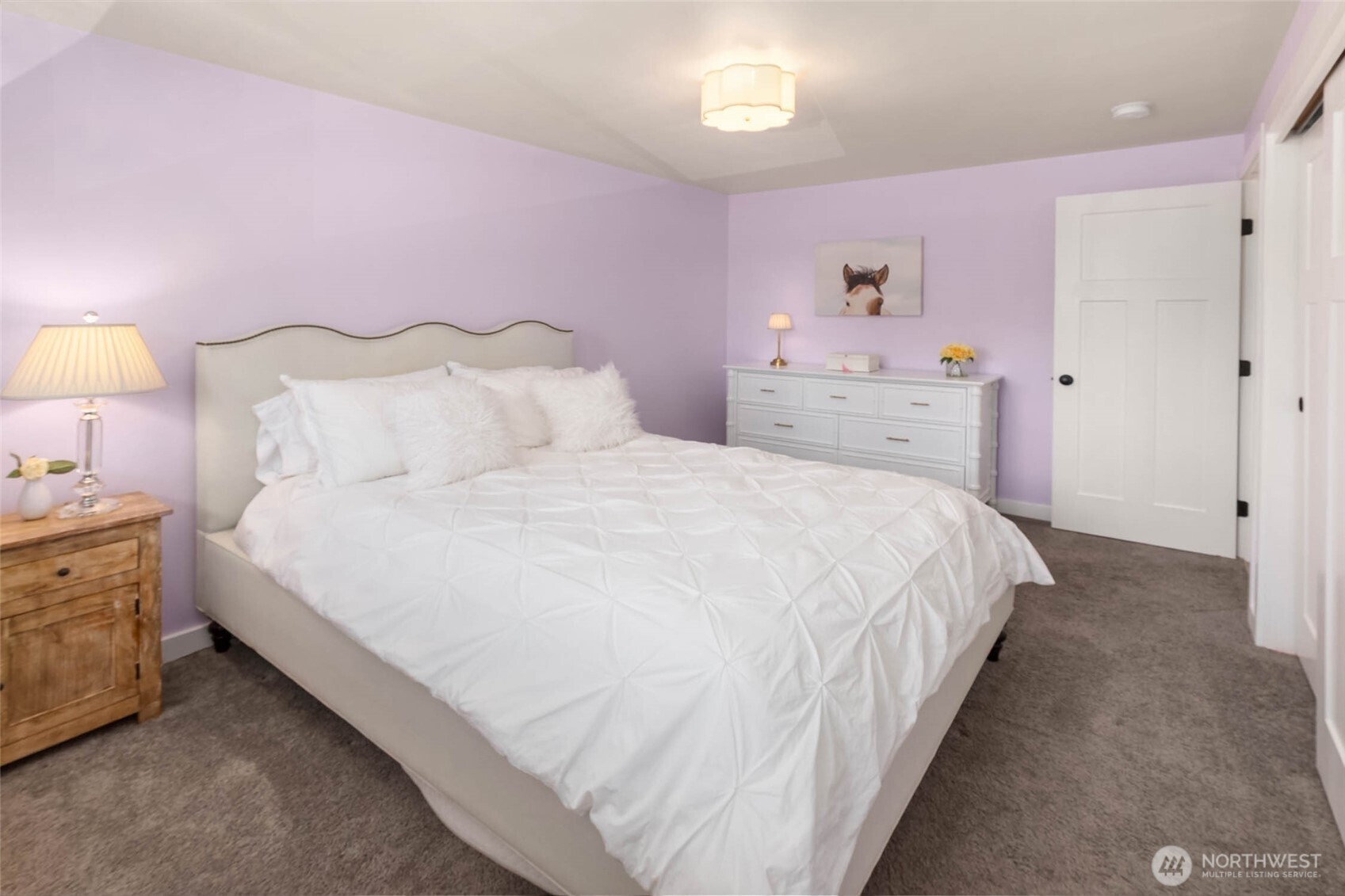 11019 23rd Drive Southeast Everett, WA 98208 - Photo 21 of 35 a bedroom with a bed and a lamp on dresser