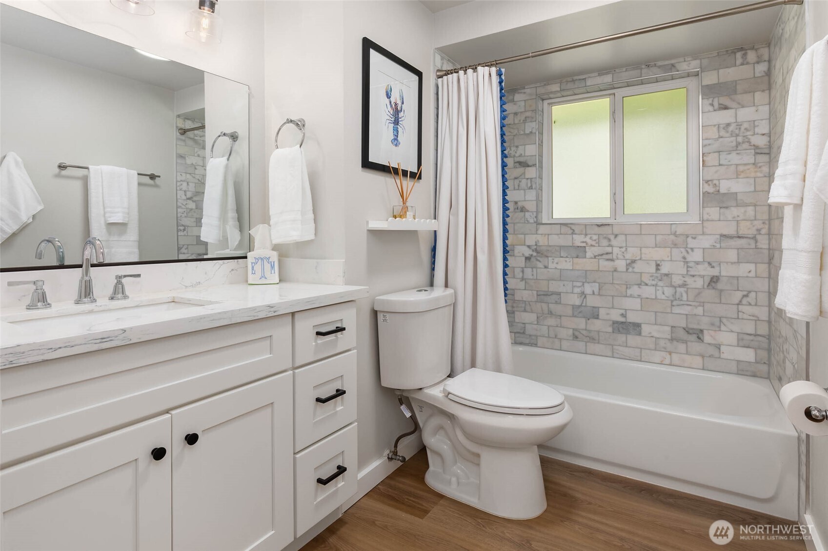 11019 23rd Drive Southeast Everett, WA 98208 - Photo 24 of 35 a bathroom with a granite countertop toilet a sink and a bathtub