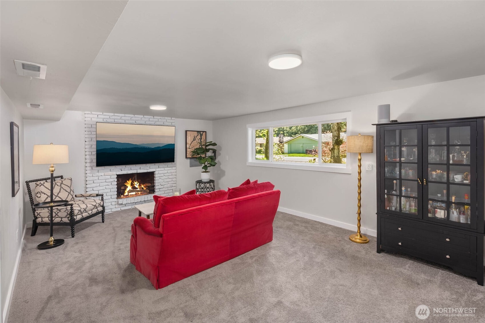 11019 23rd Drive Southeast Everett, WA 98208 - Photo 25 of 35 a living room with furniture and a flat screen tv