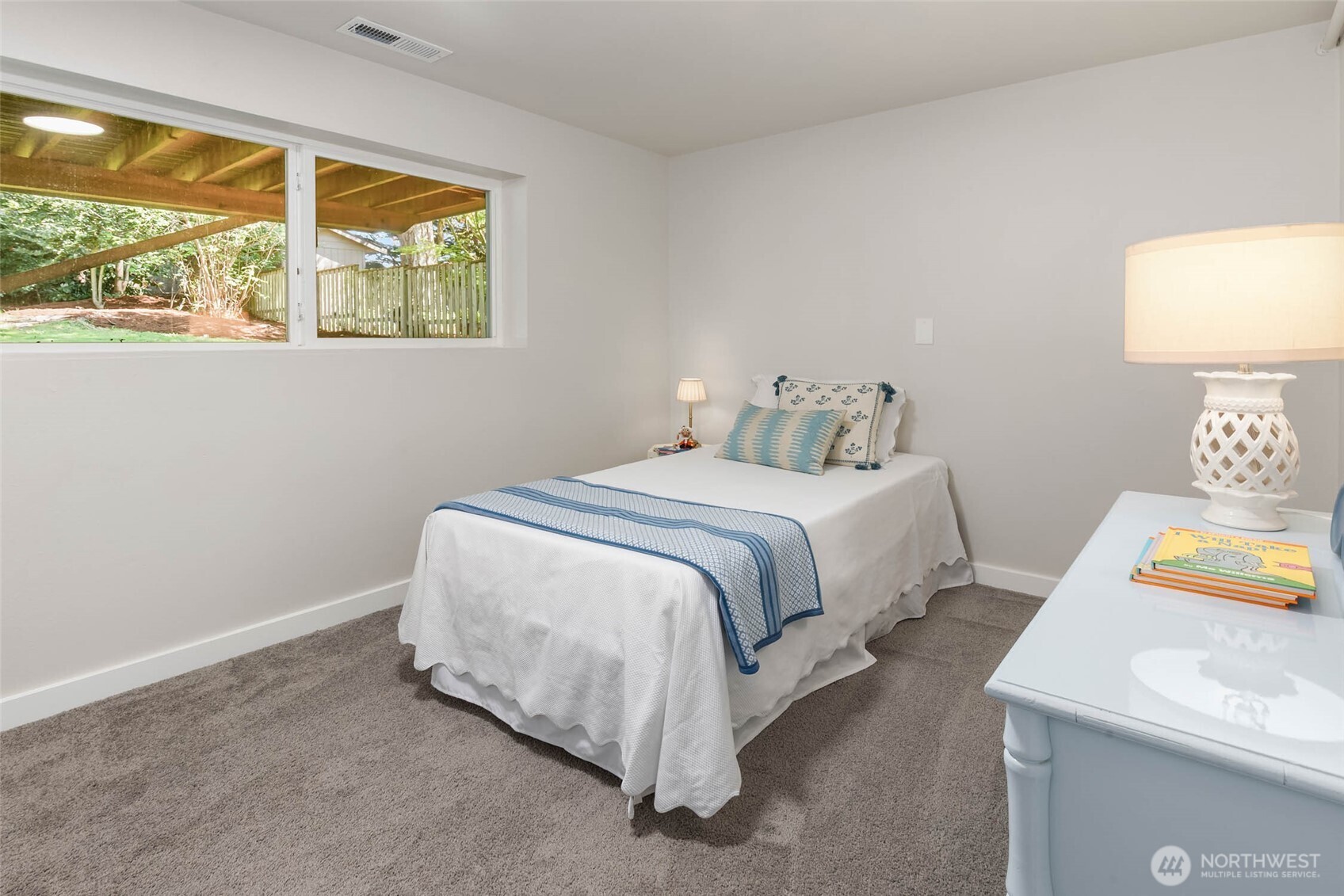 11019 23rd Drive Southeast Everett, WA 98208 - Photo 31 of 35 a bedroom with a bed and a lamp on table next to a window