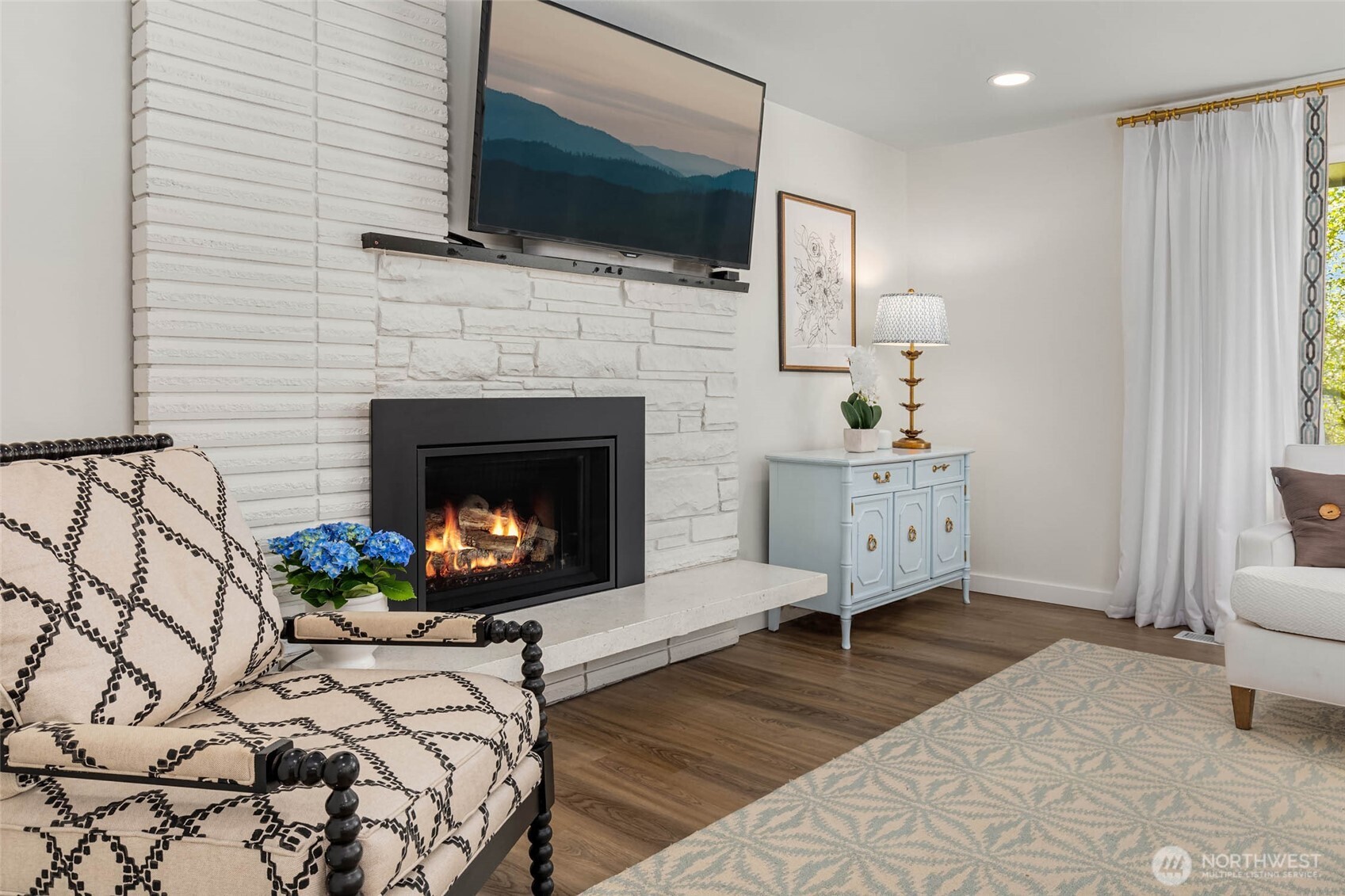 11019 23rd Drive Southeast Everett, WA 98208 - Photo 7 of 35 a living room with furniture a flat screen tv and a fireplace