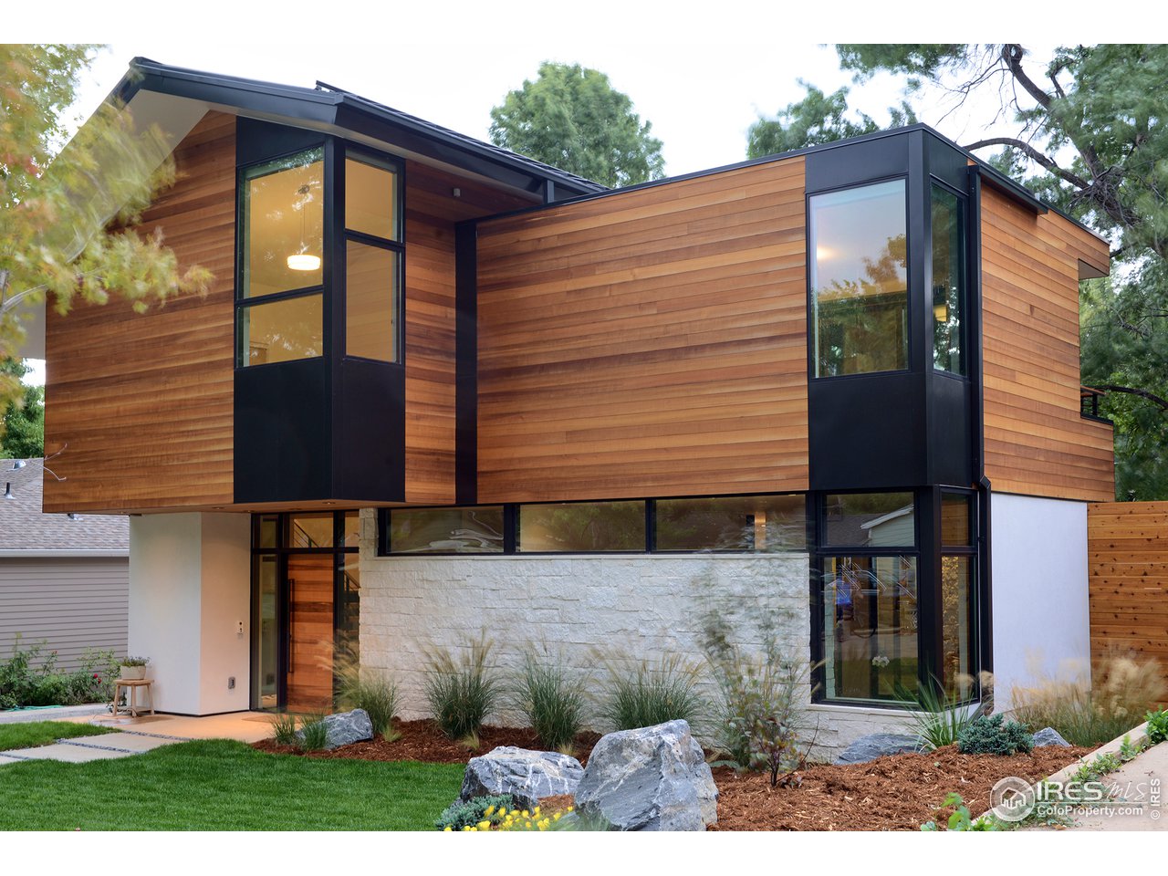 550 Iris Avenue Boulder, CO 80304 - Photo 1 of 39 a front view of a house with garden
