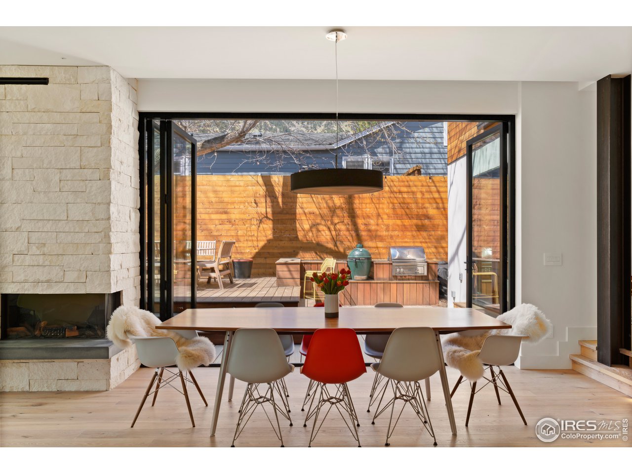 550 Iris Avenue Boulder, CO 80304 - Photo 11 of 39 a view of a dining room with furniture and a large window