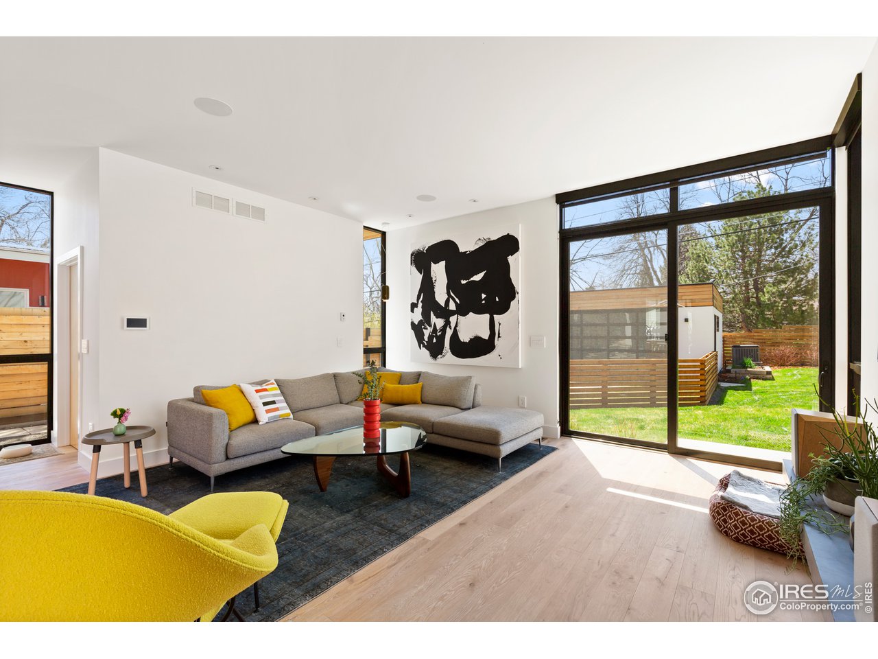 550 Iris Avenue Boulder, CO 80304 - Photo 12 of 39 a living room with furniture and a large window