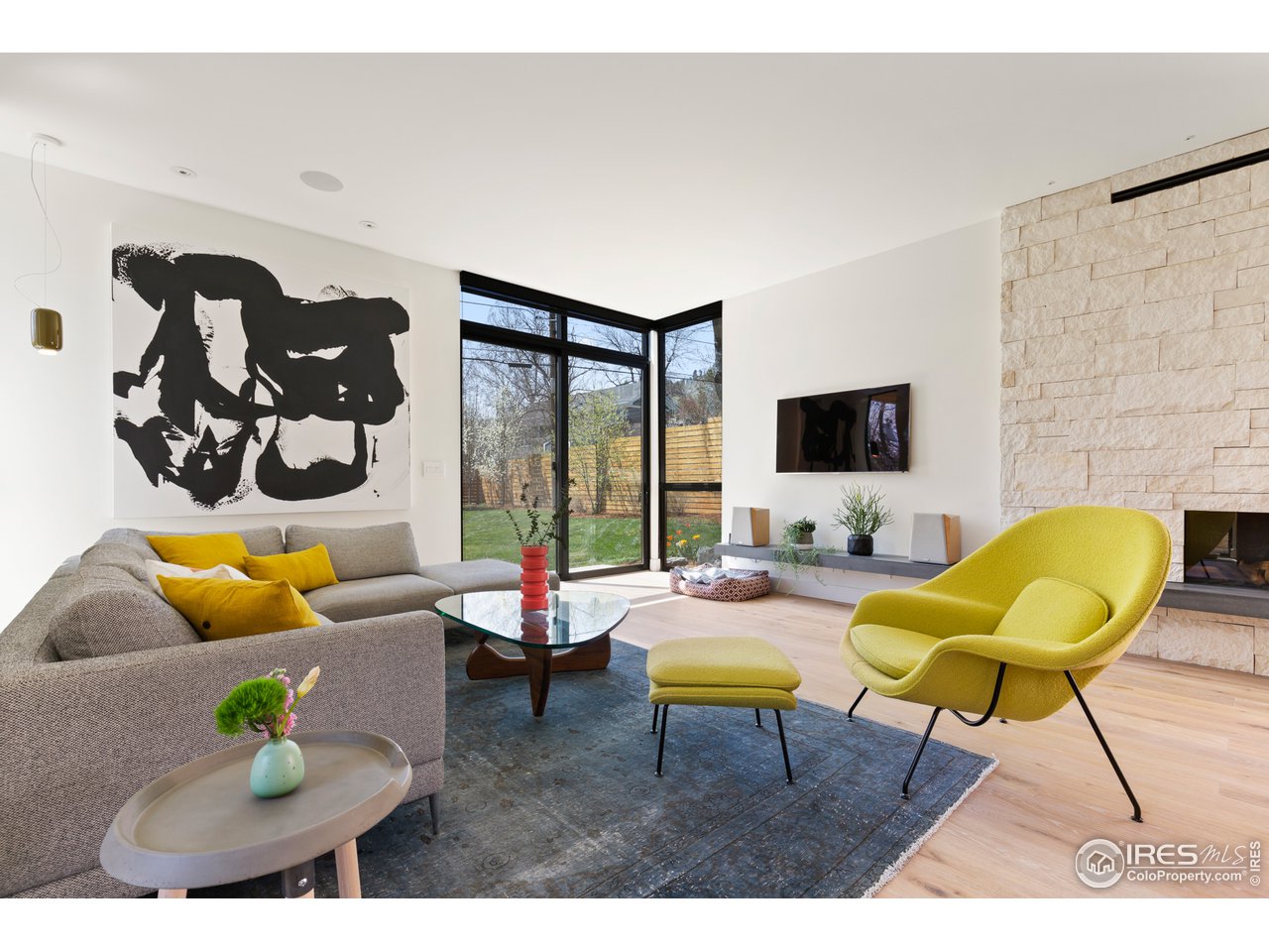 550 Iris Avenue Boulder, CO 80304 - Photo 13 of 39 a living room with furniture and a flat screen tv