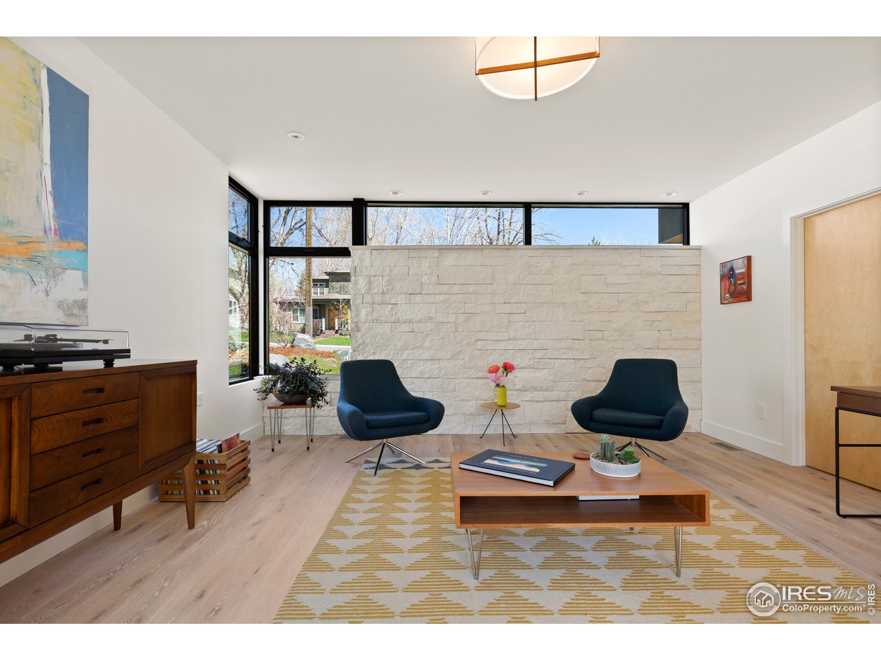550 Iris Avenue Boulder, CO 80304 - Photo 14 of 39 a living room with furniture and a fireplace