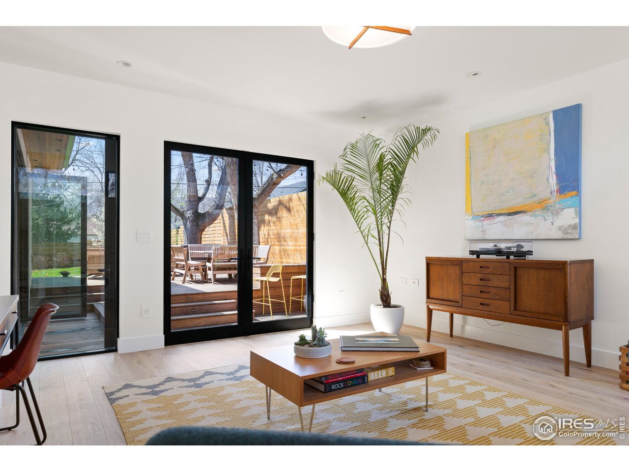 550 Iris Avenue Boulder, CO 80304 - Photo 15 of 39 a living room with furniture and a large window