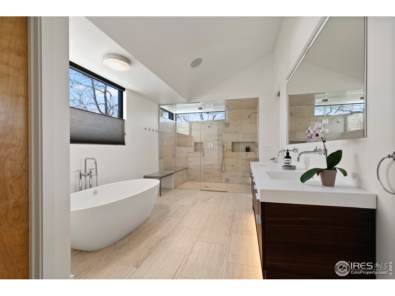 550 Iris Avenue Boulder, CO 80304 - Photo 19 of 39 a bathroom with a double vanity sink mirror and bathtub